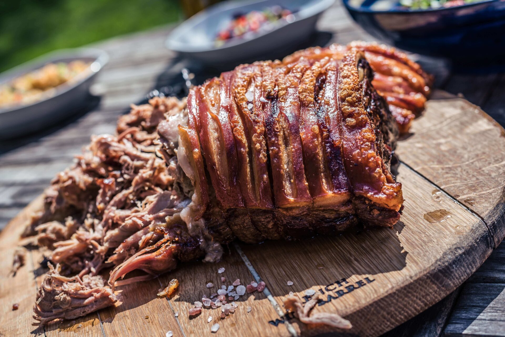 a big chunk of pulled pork on a wooden board